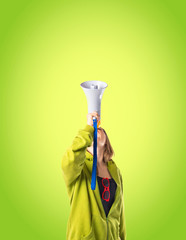 Girl shouting over green background