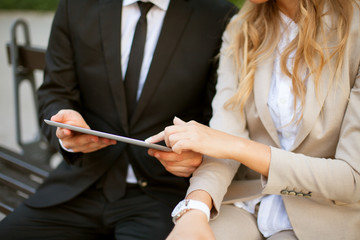 Business people with digital tablet