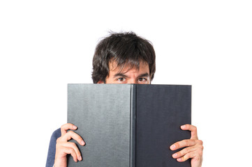 Businessman reading a book over white background