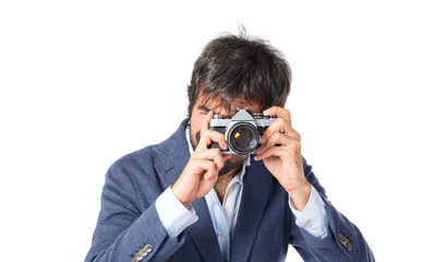 Fototapeta premium Man photographing over white background