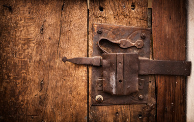 Old lock of a wooden door's Trullo in Alberobello.