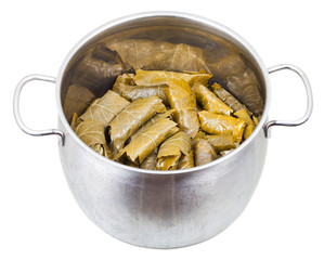 dolma from grape leaves and mince in stewpan