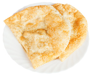 cheburek pastry on white plate isolated