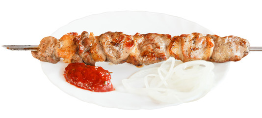 one lamb shish kebab on white plate isolated