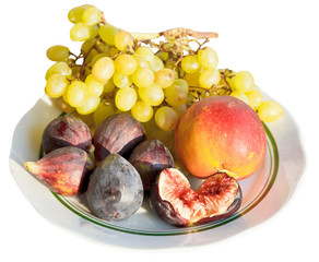 Crimean autumn seasonal fruits on plate isolated