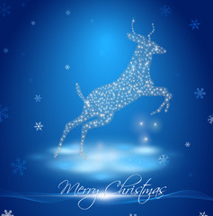 Fototapeta na wymiar goat in winter landscape with inscription Merry Christmas