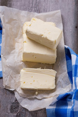 Fresh butter on wooden board.