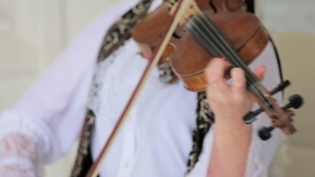 Woman Expressively Playing the Violin