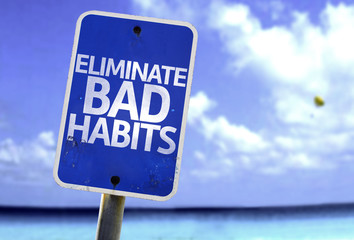 Eliminate Bad Habits sign with a beach on background