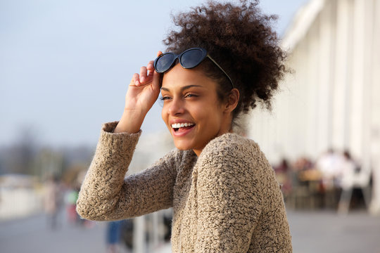 Attractive black woman smiling outdoors