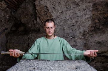 Ancient Bulgarian peasant holding a sword