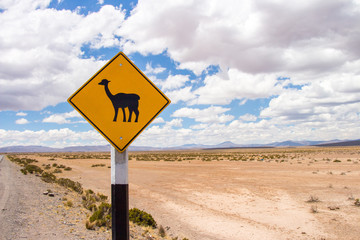 Llama Sign Warning at street in highlands of Peru