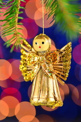 dekoracja bożonarodzeniowa, figurka aniołka na tle bokeh  - obrazy, fototapety, plakaty