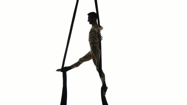 Man dancer on aerial silk, aerial contortion, aerial ribbons,