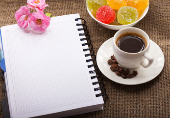 Nice breakfast with cup of coffee, flowers, blank paper for text