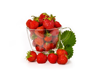 Fresh strawberries in a glass mug isolated on white background