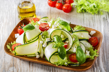 Zucchini salad with tomatoes and cheese