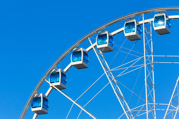 Ferris wheel over sky background