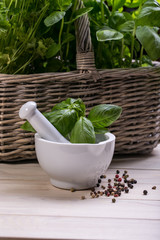 mortar and pestle - herbs and spices, fresh basil and parsley 