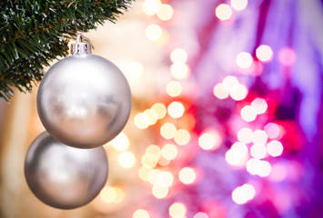 Christmas ornaments with blurred golden, purple background