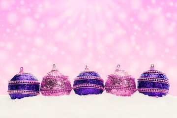 Christmas balls in snow, christmas background with bokeh