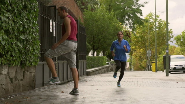 Women running in the city, slow motion shot at 240fps, steadycam