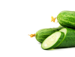 Cucumber and slices isolated over white background
