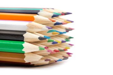 A bunch of color pencils pointing up.