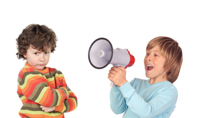 Funny angry child because of megaphone