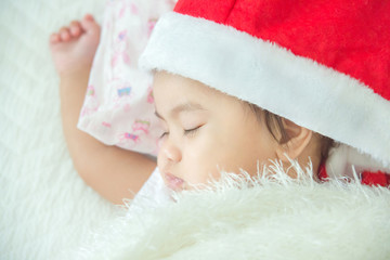 Newborn santa baby sleep in bed