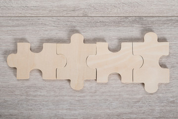 Wooden Jigsaw Pieces On Table