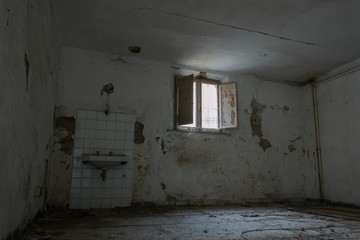 Fototapeta premium Interiors of an abandoned madhouse in the downtown