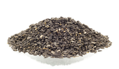 sunflower seeds pile against white background