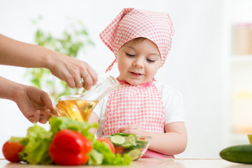 little girl with vegetables on kitchen