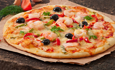 Pizza with shrimp, salmon and olives