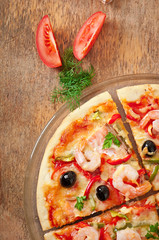 Pizza with shrimp, salmon and olives