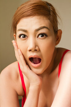 portrait of excited, surprised woman, jaw dropping