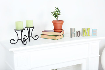 Fireplace with beautiful decorations in comfortable living room