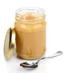 Creamy peanut butter in jar, isolated on white