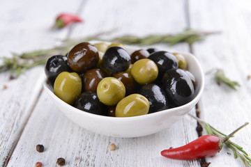 Different marinated olives on table close-up