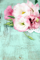 Beautiful eustoma flower on wooden background