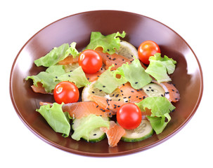 Appetizing fish salad with vegetables on plate isolated on