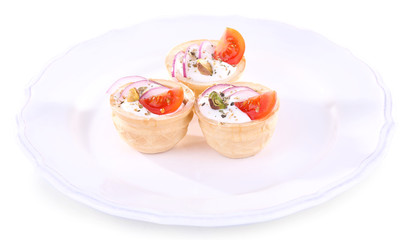 Tartlets with greens and vegetables with sauce