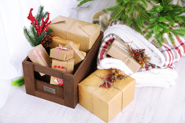 Fototapeta na wymiar Christmas presents and decorations in boxes near Christmas tree
