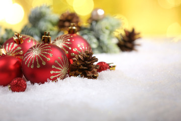 Fototapeta na wymiar Christmas balls on snow close-up