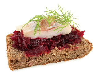 Canape herring with beets on rye toast, isolated on white