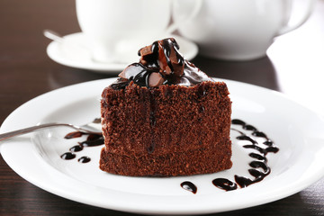 Yummy chocolate cake served on table, close-up