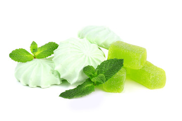 Mint color meringues and mint jelly candies isolated on white