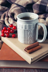 Cup of tea with book on table close-up