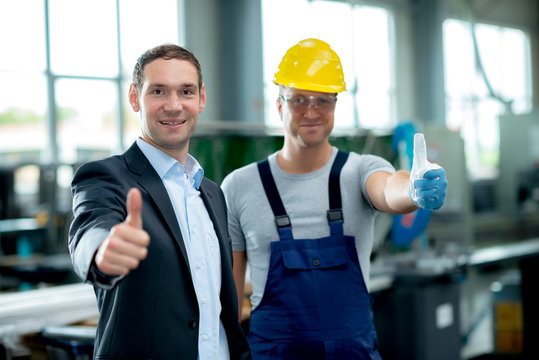 good teamwork in factory with thumbs up